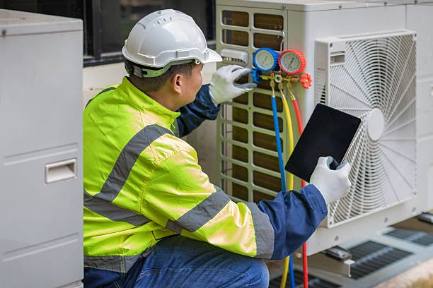Professional Air Conditioning Repair technician working in Ortonville, MI